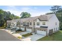 Row of townhouses with attached garages and landscaping at 348 Elgin Dr # 162, Lawrenceville, GA 30045