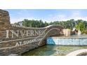 Inverness at Sugarloaf community entrance with stonework and water feature at 348 Elgin Dr # 162, Lawrenceville, GA 30045