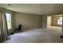 Spacious living room with neutral walls and carpeted floors at 2112 Bradford Pear Se Cir, Conyers, GA 30013