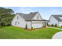 Side view of one-story house with light-colored siding at 3869 Tielman St, Snellville, GA 30078