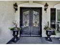 Elegant front entrance featuring double doors and ornate ironwork at 1012 Jubilee Way, Powder Springs, GA 30127