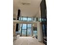 Two-story great room with floor to ceiling windows and marble fireplace at 2147 Briarwillow Ne Dr, Atlanta, GA 30345