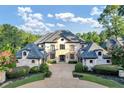 Elegant home's exterior features a grand entrance and manicured landscaping at 4317 Oglethorpe Nw Loop, Acworth, GA 30101