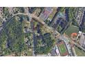 Aerial view of a triangular lot near a school and road at 5015 Suwanee Dam Rd, Suwanee, GA 30024