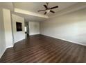 Spacious living room featuring hardwood floors and neutral color palette at 340 Rosenwald Ln, Hampton, GA 30228