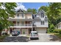 Townhomes with attached garages and landscaping at 581 Cooper Sw St, Atlanta, GA 30312
