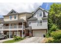 Gray townhome with attached garage and landscaping at 581 Cooper Sw St, Atlanta, GA 30312