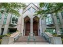 Modern building exterior with double wood doors and landscaping at 2870 Pharr Court South Nw # 607, Atlanta, GA 30305