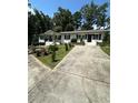 Ranch home with paved driveway and landscaping at 3503 Larkspur Ter, Decatur, GA 30032