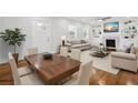Bright living room with hardwood floors, fireplace, and built-in shelving at 1875 Langston Sw Ave, Atlanta, GA 30310