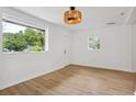 Spacious living area featuring light walls and wood-look floors at 1410 Elizabeth Sw Ave, Atlanta, GA 30310