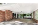 Covered carport with brick columns and access to a screened porch at 4028 Creel Dr, Lithia Springs, GA 30122