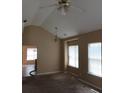 Bright dining area with vaulted ceiling and chandelier at 435 Victoria Blvd, Oxford, GA 30054