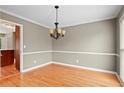 Simple dining room with hardwood floors and chandelier at 2990 Mountain Ne Trce, Roswell, GA 30075