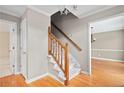 Wooden staircase with a white carpeted stairwell at 2990 Mountain Ne Trce, Roswell, GA 30075