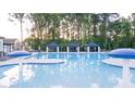 Community pool with three cabanas offering shade and relaxation at 305 Silver Moon Dr, Loganville, GA 30052