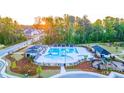 Community pool with multiple cabanas and playground at 305 Silver Moon Dr, Loganville, GA 30052