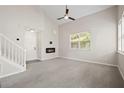 Spacious living room with high ceilings, neutral walls and carpeting at 210 Hiawassee Dr, Woodstock, GA 30188