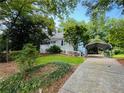 Cute ranch home with carport and lush landscaping at 2606 Ramblewood Ct, Acworth, GA 30102