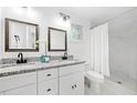 Updated bathroom with double vanity and marble shower at 2581 Hood Nw Ave, Atlanta, GA 30318