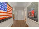 Bright entryway with hardwood floors and large artwork at 15 Paces West Nw Dr, Atlanta, GA 30327