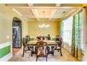 Formal dining room with coffered ceiling and elegant furnishings at 4293 Sublime, Atlanta, GA 30349