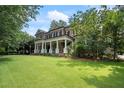 Two-story brick home with a large front yard at 1750 Doncaster Ne Dr, Atlanta, GA 30309