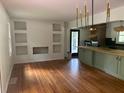 Spacious dining room with hardwood floors and built-in shelving at 2381 County Line Sw Rd, Atlanta, GA 30331