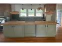Large kitchen island with butcher block countertop at 2381 County Line Sw Rd, Atlanta, GA 30331