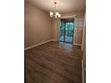 Bright dining room with laminate flooring and access to a deck at 140 Huntridge Dr, Stockbridge, GA 30281