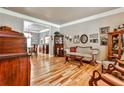Living room with hardwood floors, antique furniture, and large windows at 738 Key Largo Ct, Auburn, GA 30011