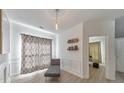 Bright living room with chaise lounge, wood floors, and neutral decor at 388 Oakhaven Way, Villa Rica, GA 30180