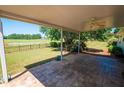 Covered patio with ceiling fan overlooking green space at 1001 S Creek Dr, Villa Rica, GA 30180