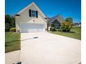 One-story house with a two-car garage and landscaped yard at 1001 S Creek Dr, Villa Rica, GA 30180