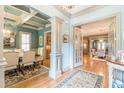 Bright entryway with hardwood floors, a view of the dining room, and French doors at 1829 Buckhead Valley Ne Ln, Atlanta, GA 30324