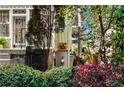 Home exterior with garden and signage at 56 17Th Ne St, Atlanta, GA 30309