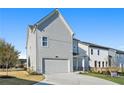 Attached garage with gray siding and a driveway at 1936 Stanfield Nw Ave, Atlanta, GA 30318