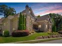 Brick home with stone accents and a beautifully landscaped yard at 850 Camden Park Ct, Atlanta, GA 30342