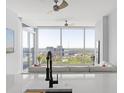 Living room with floor to ceiling windows and city view at 3325 Piedmont Rd # 2203, Atlanta, GA 30305