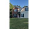Brick and beige two-story house with a welcoming front entrance at 635 Beddick Ln, Atlanta, GA 30349