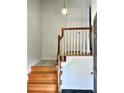 Light-colored wood staircase with a white railing leading to the second floor at 14 Saint Claire Ne Ln, Atlanta, GA 30324