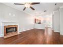 Spacious living room with hardwood floors, fireplace, and access to kitchen at 131 Bowen Sw Cir, Atlanta, GA 30315