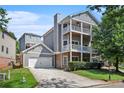 Two-story house with gray siding, large windows, and a two-car garage at 131 Bowen Sw Cir, Atlanta, GA 30315