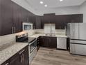 Modern kitchen with stainless steel appliances at 745 Fountainhead Ne Ln # 113, Atlanta, GA 30324