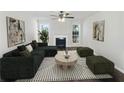 Virtually staged living room with fireplace and modern furniture at 3853 Cress Way Dr, Decatur, GA 30034