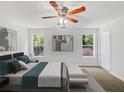 Virtually staged main bedroom with ample natural light at 3853 Cress Way Dr, Decatur, GA 30034