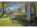 Gray sided home with red door and white railing at 1962 Virginia Ave, College Park, GA 30337