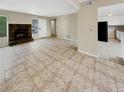 Living room features tile floors and a stone fireplace at 707 Pine Tree Trl # 10B, Atlanta, GA 30349
