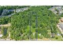 Aerial view of property showing wooded lot and house at 276 Thompson St, Alpharetta, GA 30009
