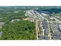 Aerial view of community with townhouses and green space at 276 Thompson St, Alpharetta, GA 30009